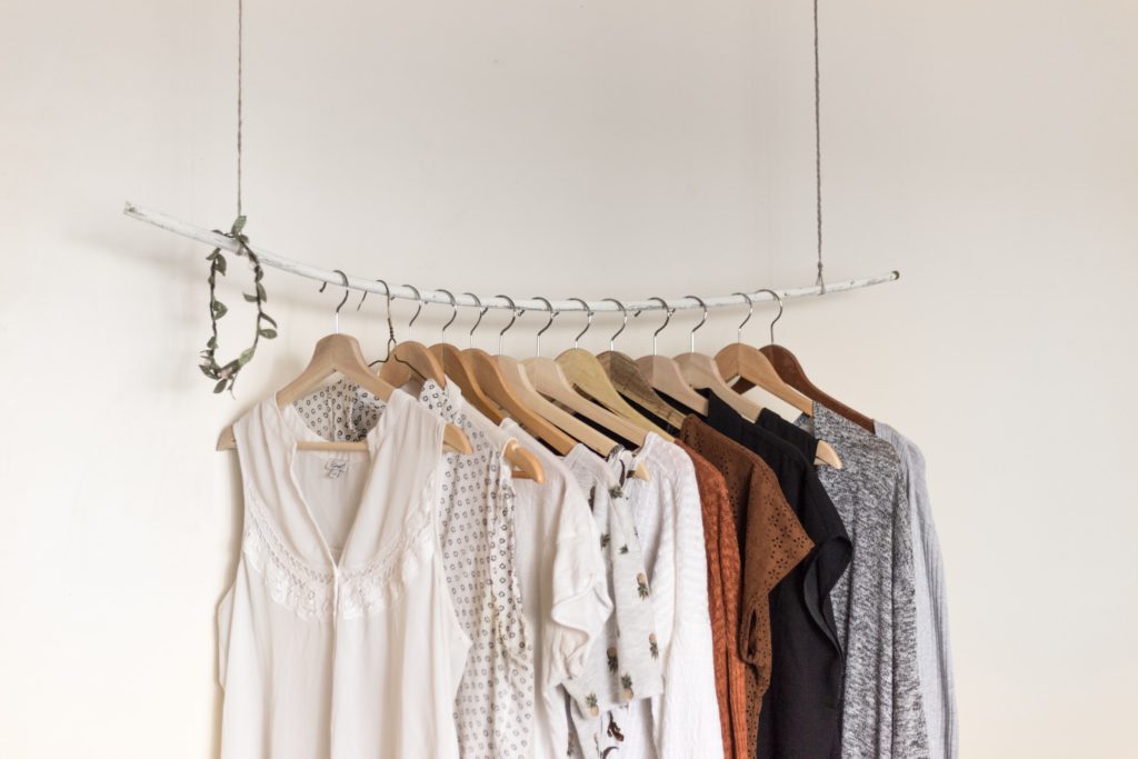 Ladies clothes on hangers on a rail