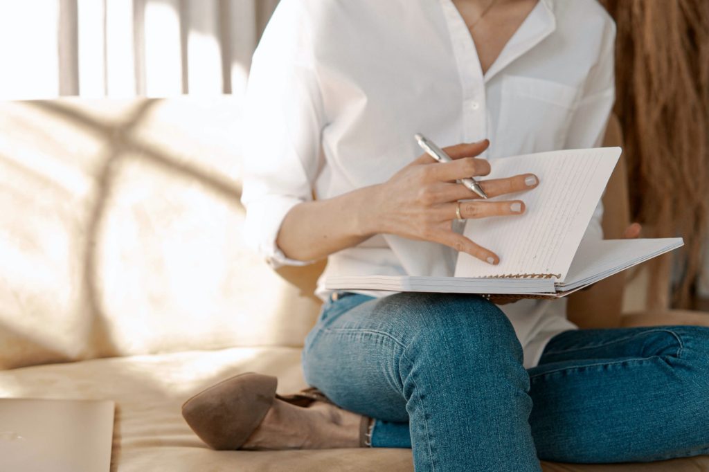 lady with notepad making notes